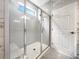 Bright bathroom showcasing a glass shower, contemporary tile work, and stylish finishes at 2838 Menton Rd, Powder Springs, GA 30127