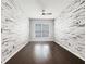 Bedroom showcasing decorative white walls, hardwood floors, and a window for natural light at 2838 Menton Rd, Powder Springs, GA 30127