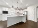 Modern kitchen featuring stainless steel appliances, an island, and white cabinets at 2838 Menton Rd, Powder Springs, GA 30127