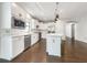Modern kitchen boasting white cabinetry, a kitchen island, and stainless steel appliances at 2838 Menton Rd, Powder Springs, GA 30127