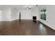 Spacious living room with hardwood floors, fireplace, and large windows overlooking backyard at 2838 Menton Rd, Powder Springs, GA 30127