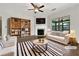 Beautifully staged living room with fireplace, built-in shelves, and plenty of natural light at 2838 Menton Rd, Powder Springs, GA 30127