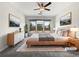 Comfortable main bedroom with large windows, ceiling fan, and neutral decor at 2838 Menton Rd, Powder Springs, GA 30127