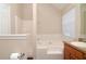 Bathroom features tub, shower, toilet, vanity, and window at 5942 Idlewood Pl, Lithonia, GA 30038