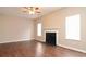 Spacious living room featuring a cozy fireplace, neutral paint, and lots of natural light at 5942 Idlewood Pl, Lithonia, GA 30038
