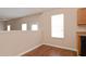 Open loft space with abundant natural light, laminate flooring and neutral walls at 5942 Idlewood Pl, Lithonia, GA 30038