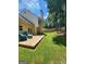 Spacious backyard featuring a deck, lush lawn, mature trees, and privacy fence at 1447 Evanston, Marietta, GA 30062