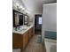 Bathroom featuring a large vanity, double mirrors, and modern fixtures at 1447 Evanston, Marietta, GA 30062