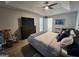 Comfortable bedroom with a queen-size bed, ceiling fan, and neutral decor at 1447 Evanston, Marietta, GA 30062