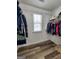 Walk-in closet with ample storage space and wooden floors at 1447 Evanston, Marietta, GA 30062