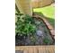 Close up of a well maintained flower bed with healthy plants and decorative rock at 1447 Evanston, Marietta, GA 30062