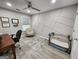 Bright home office with modern ceiling fan, accent wall, and view from window at 1447 Evanston, Marietta, GA 30062