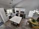 Kitchen with white cabinets, stainless steel appliances, and an island with bar stool seating at 1447 Evanston, Marietta, GA 30062
