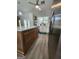 Open kitchen with hardwood floors, stainless steel appliances, white cabinets, and a kitchen island at 1447 Evanston, Marietta, GA 30062