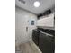 Convenient laundry room with modern washer and dryer, and extra overhead storage space at 1447 Evanston, Marietta, GA 30062