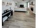 Bright living room featuring hardwood floors, fireplace, and ample natural light at 1447 Evanston, Marietta, GA 30062