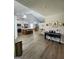 Open-concept living space features a modern kitchen, dining area, and living area at 1447 Evanston, Marietta, GA 30062