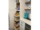 A peek inside the pantry reveals pull-out shelves and ample space at 1447 Evanston, Marietta, GA 30062