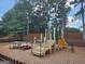 Community playground with slide, climbing structure, swings and picnic tables at 1447 Evanston, Marietta, GA 30062