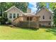 Expansive backyard featuring a large wooden deck and lush green lawn for outdoor enjoyment at 15 Miners Pt Se, Acworth, GA 30102