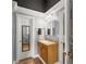 Bathroom featuring tan granite countertops, a mirror, and wooden cabinets at 15 Miners Pt Se, Acworth, GA 30102