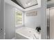 Bathroom featuring a soaking tub and a window for natural light at 15 Miners Pt Se, Acworth, GA 30102
