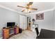 Bedroom with a desk, ceiling fan, and closet that provides a quiet and peaceful space at 15 Miners Pt Se, Acworth, GA 30102