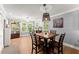 Dining room with a square, four-chair dining table surrounded by large windows at 15 Miners Pt Se, Acworth, GA 30102