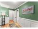 Entry hallway featuring art, wall paneling, and hardwood floors at 15 Miners Pt Se, Acworth, GA 30102