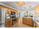 Charming kitchen features stainless steel appliances, granite countertops, and wood cabinets at 15 Miners Pt Se, Acworth, GA 30102