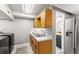 Laundry room featuring stainless steel appliances and an adjacent bathroom at 15 Miners Pt Se, Acworth, GA 30102