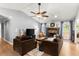Cozy living room with a brick fireplace, comfortable seating, and abundant natural light at 15 Miners Pt Se, Acworth, GA 30102