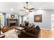 Spacious living room featuring a brick fireplace, vaulted ceilings, and a hardwood floor at 15 Miners Pt Se, Acworth, GA 30102