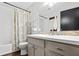 Bathroom with a shower/tub and a sink vanity featuring a unique brick backsplash at 2136 N Landing Way, Marietta, GA 30066
