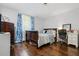 Comfortable bedroom with hardwood floors, featuring an area for desk and chair at 2136 N Landing Way, Marietta, GA 30066