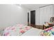 Bright bedroom with closet, doorway to bath, hardwood floors, and cozy patchwork quilt at 2136 N Landing Way, Marietta, GA 30066