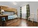 Comfortable ' bedroom with a chandelier, hardwood floors, and bunk beds at 2136 N Landing Way, Marietta, GA 30066