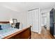 Bright bedroom with hardwood floors, spacious closet and open doorway to the bathroom at 2136 N Landing Way, Marietta, GA 30066