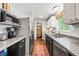 View of kitchen featuring stainless appliances, modern cabinetry, and hardwood floors at 2136 N Landing Way, Marietta, GA 30066