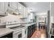 Updated kitchen includes modern appliances, laminate countertops, and hardwood floors at 2136 N Landing Way, Marietta, GA 30066