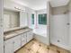 Spacious bathroom with a separate shower, tub, and double sink vanity at 268 Heathrow Dr, Riverdale, GA 30274