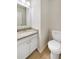 Bathroom featuring a granite-topped vanity at 268 Heathrow Dr, Riverdale, GA 30274