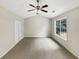 Bedroom with carpeted floors, closet and a bright window at 268 Heathrow Dr, Riverdale, GA 30274