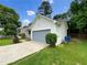 View of home's siding and attached garage at 268 Heathrow Dr, Riverdale, GA 30274