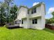 Two-story home featuring a spacious backyard with a wood deck and mature trees at 268 Heathrow Dr, Riverdale, GA 30274