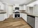 Well-lit kitchen with stainless steel appliances and granite countertops at 268 Heathrow Dr, Riverdale, GA 30274