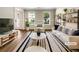 Bright living room with stylish furniture, large windows, and modern decor at 268 Heathrow Dr, Riverdale, GA 30274