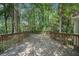 Spacious wooden back deck perfect for outdoor entertaining surrounded by trees at 2695 Moon Cabin Dr, Powder Springs, GA 30127