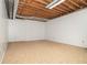 Basement featuring unfinished ceilings, concrete walls, and carpet flooring at 2695 Moon Cabin Dr, Powder Springs, GA 30127