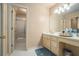 Clean and well-maintained bathroom with tiled floor, shower, and vanity sink at 2695 Moon Cabin Dr, Powder Springs, GA 30127